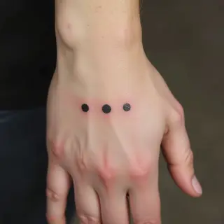 What Does a Three Dot Tattoo on Your Hand Mean?