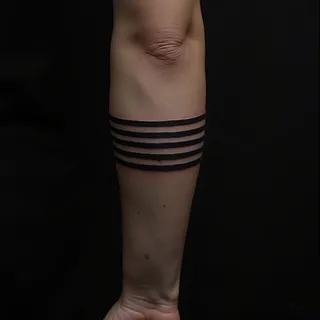 Black Stripe on Arm Tattoo: Meaning, Symbolism & Design Ideas