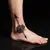 Oriental Arrow Compass Foot Tattoo: Navigating Life's Path with Meaning