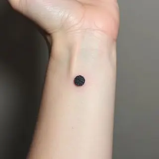 The Whispered Meaning of a Dot Tattoo on Your Wrist: A Journey Through Symbolism