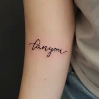 Delicate Fine Line Script Tattoo on Forearm