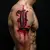 Men's Gothic Lettering Tattoos: Bold Red Body Art Ideas