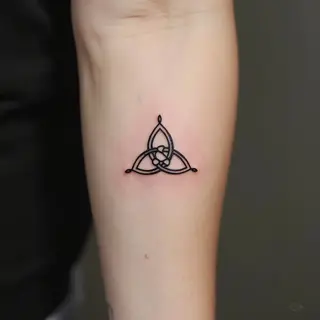 Delicate Triquetra Tattoo: A Symbol of Connection and Meaning