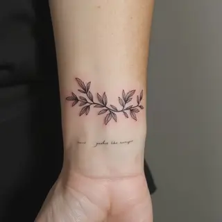 Minimalist Leafy Branch Tattoo with Inspiring Script