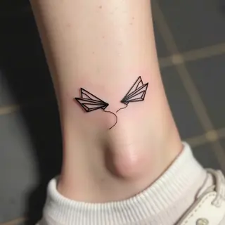 Minimalist Paper Airplane Tattoos: A Symbol of Freedom and Connection