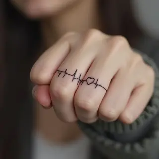 Delicate Finger Heartbeat Tattoo Design