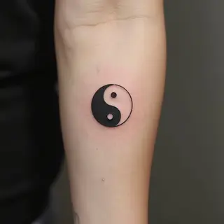Minimalist Yin Yang Forearm Tattoo