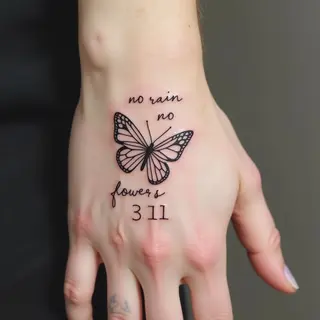 Delicate Butterfly and Script Tattoos on Hand