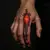 Surreal Finger Tattoos in Red & Orange: Meaningful Designs