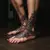 Rihanna's Tribal Hand Tattoo Meaning & Blackwork Foot Designs